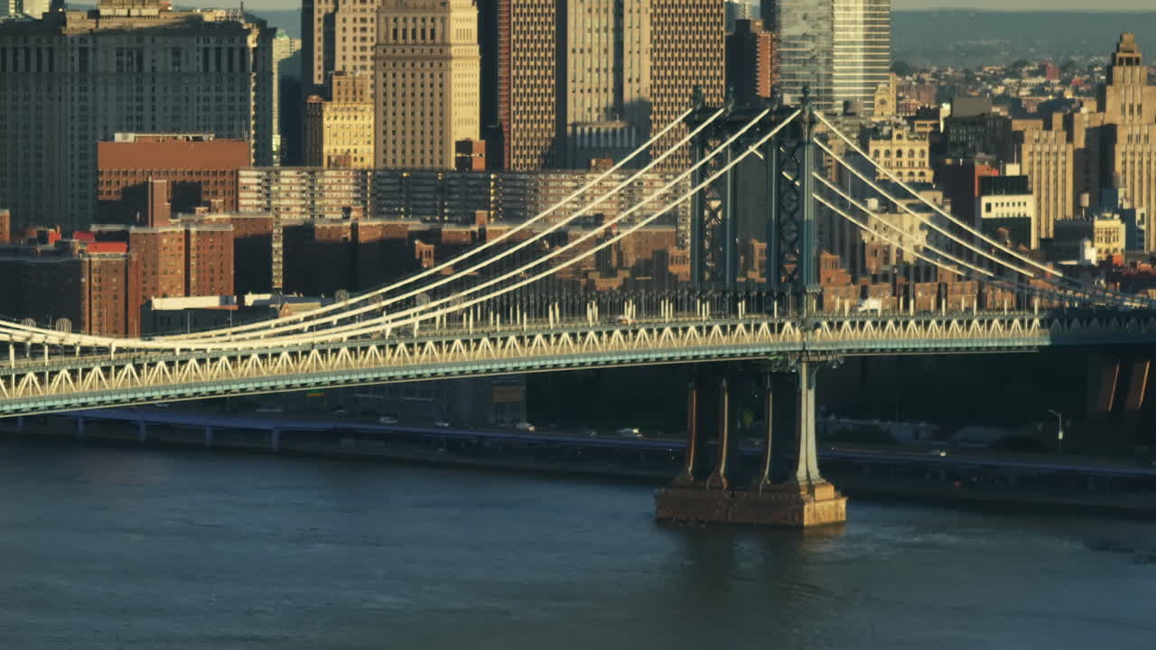 Aerial view of the Manhattan Bridge at sunrise. Shot along the East River in New York City.