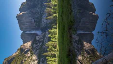 Vertical View of Yosemite Falls With Reflection In The Water In Yosemite Valley, California, USA