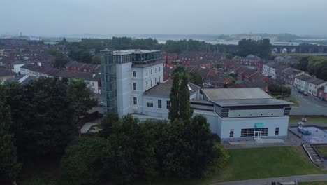 Aerial-view-Widnes-Catalyst-science-discovery-centre-museum-modern-building-orbit-left-above-public-park