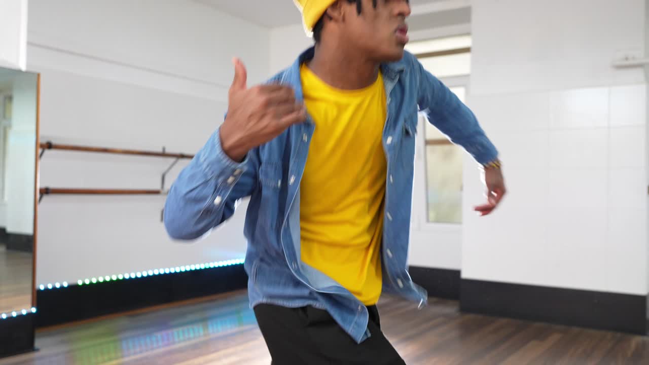 A man is dancing in a studio