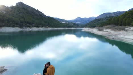 couple by a scenic mountain lake
