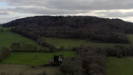 Aerial-descent-of-Knockma-hill-and-and-its-wooded-area,-Galway,-Ireland