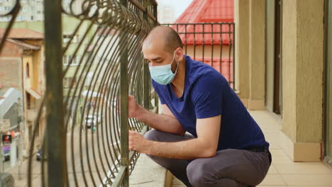 Man-with-anxiety-problems-sitting-on-the-balcony