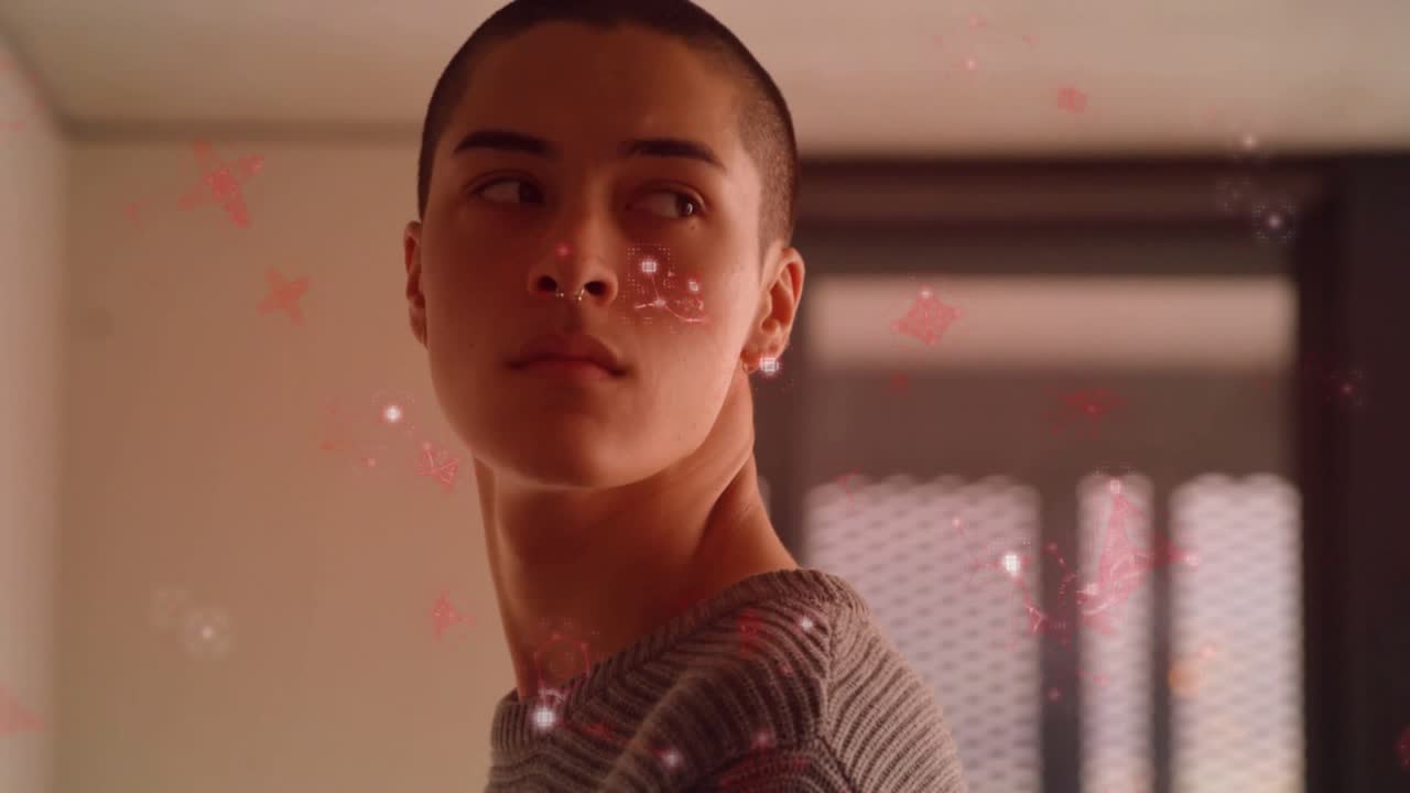 Man standing in room tracking floating red particles circling head showing interactive technology