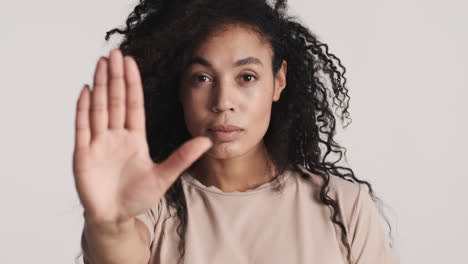 african american confident woman over white background.