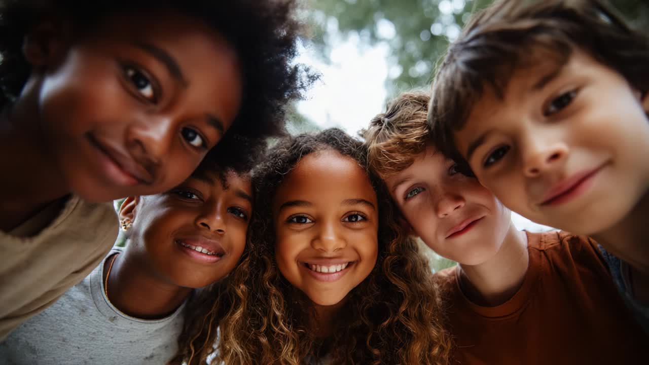 A joyful group of diverse children smiles warmly at the camera, captured in two frames showing their delightful expressions and strong bond of friendship in a bright outdoor setting full of nature
