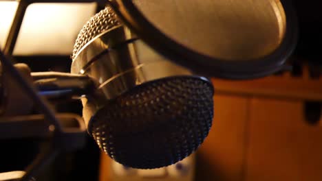 slow panning right close up of studio microphone