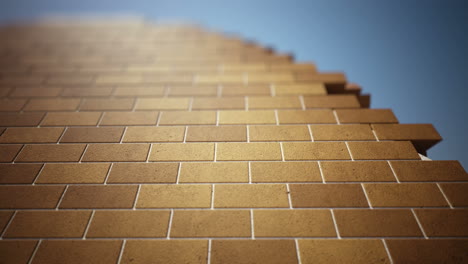 Animation-presenting-the-brick-technology-building-wall.-One-brick-on-another-filled-and-connected-with-the-white-grey-concrete-at-the-perfectly-clear-blue-sky-environment.-Left-to-the-right.-HD