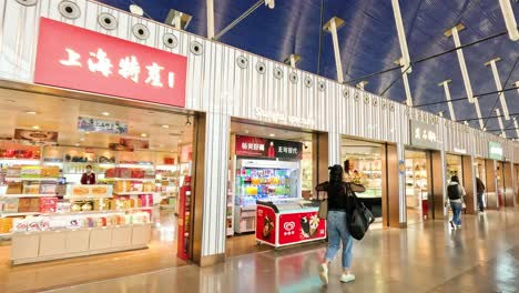 people browsing shops at shanghai airport