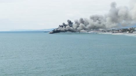 aerial view of pier on fire