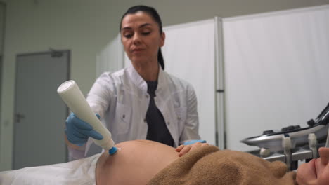 pregnant woman laying on stretcher