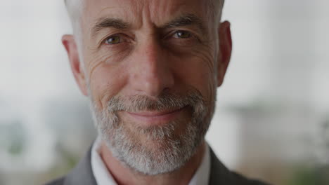 close up portrait confident senior businessman looking pensive turns head smiling enjoying professional career success slow motion