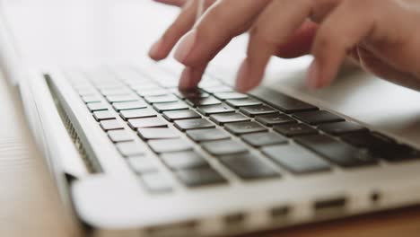 woman typing on a laptop