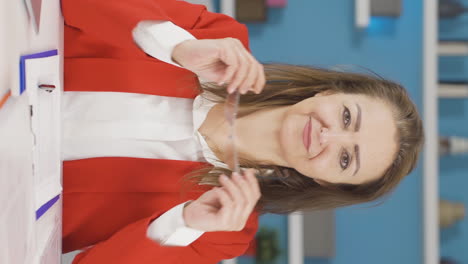 Vertical-video-of-Home-office-worker-woman-smiling-at-camera.