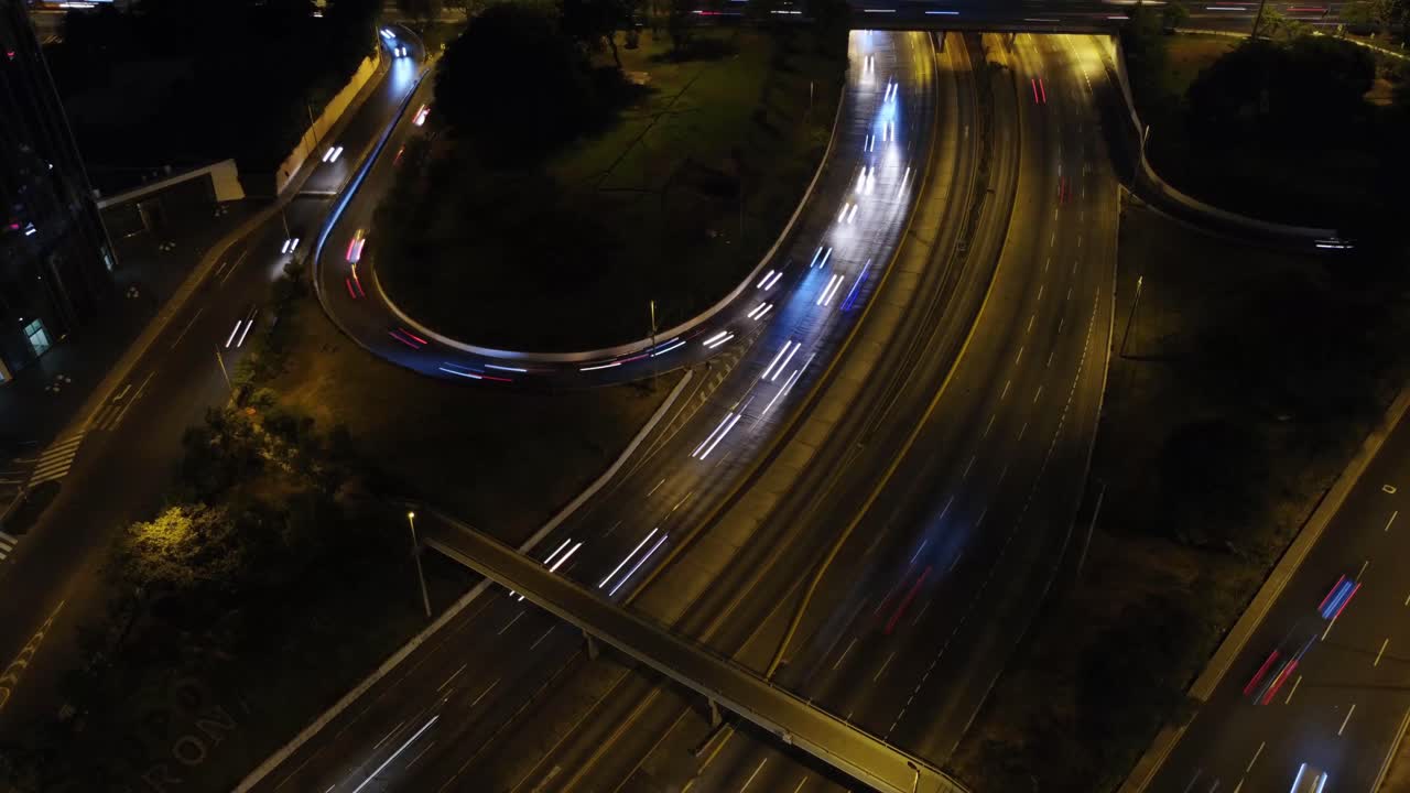 Drone hyperlapse of a freeway bridge during night time
