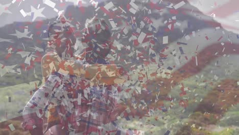 Animation-of-american-flag-and-confetti-moving-over-couple-embracing