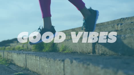 animation of words good vibes over woman exercising on promenade by the sea