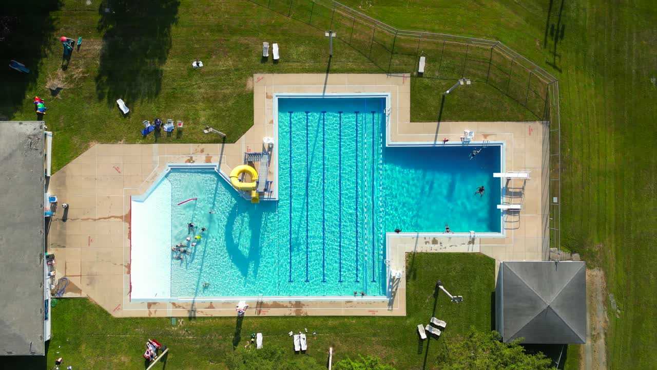 Aerial drone view of swimming pool from above.