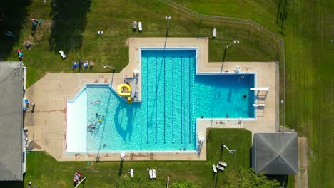 aerial drone view of swimming pool from above.