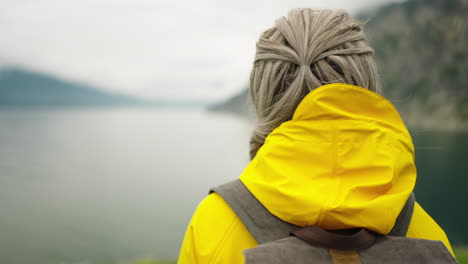 woman hiking in mountains by the lake