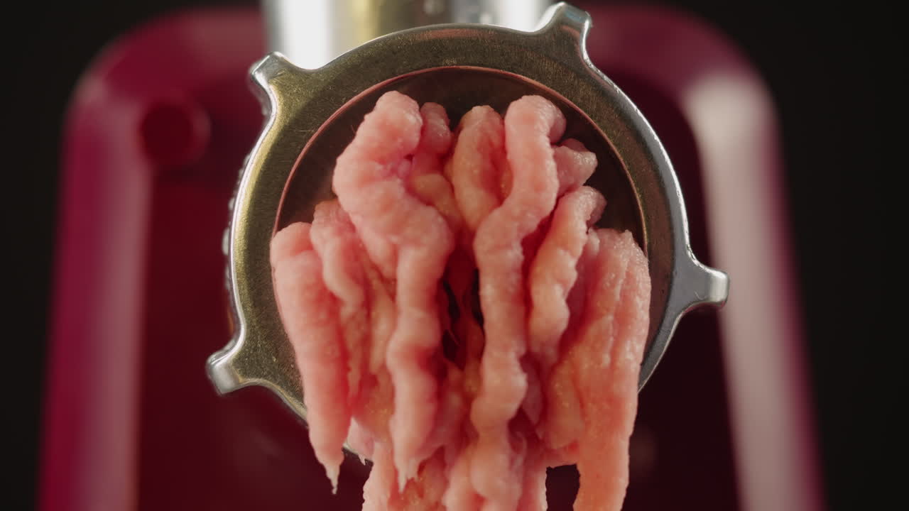 Ground Meat Coming Out of a Meat Grinder