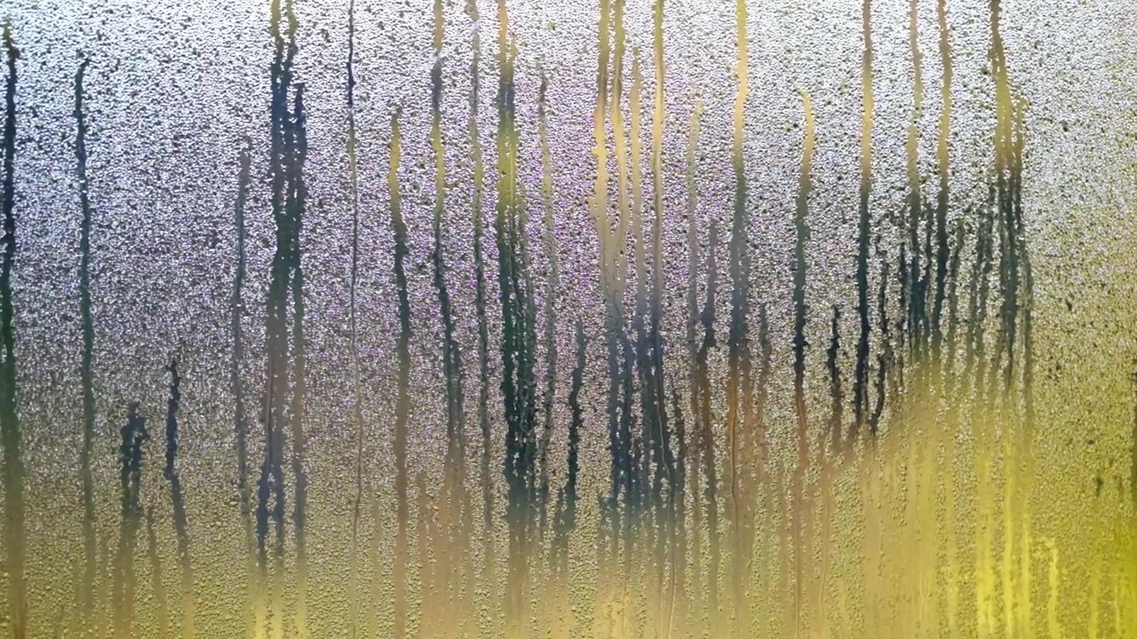 Water forms on a glass window due to condensation