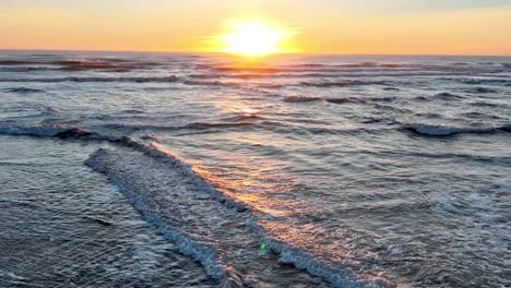 sun rising over scenic ocean in south iceland - wide shot