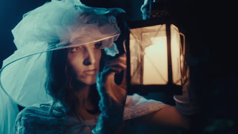 woman with lantern in dark, mysterious setting