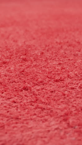 fluffy reverse side of painted red cow leather sheet as background macro view. material prepared in sewing shop. design ideas and decorative techniques