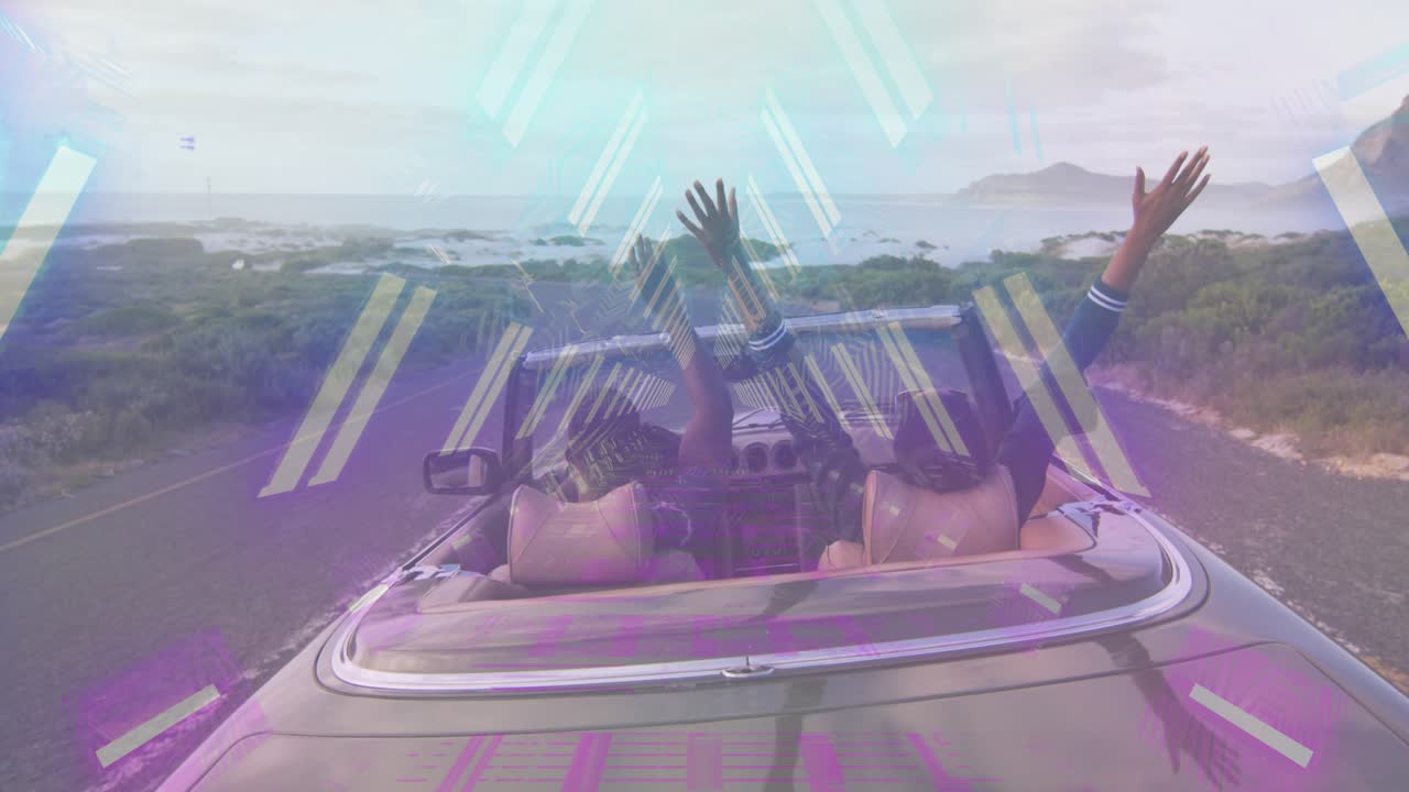 Passenger turning and raising arm causing driver raising arms cheering coast auto neon tracing arms
