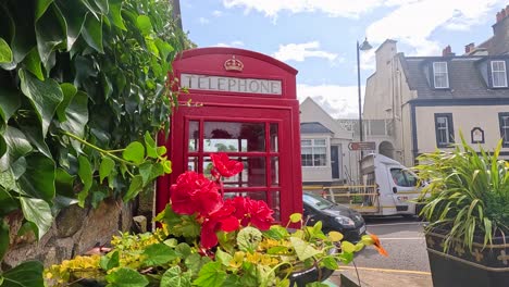 red telephone booth in a town