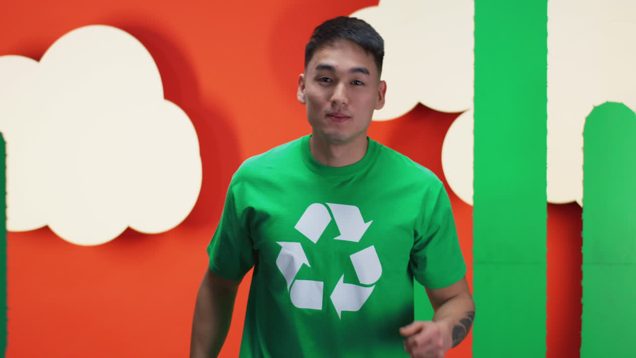 Man in Green Shirt with Recycling Symbol