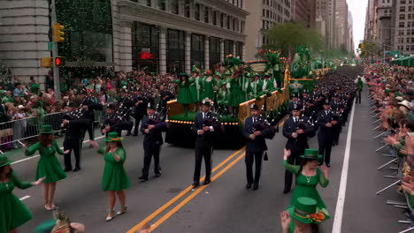 st. patrick's day parade with bagpipers and floats