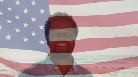 animation of flag of usa over happy biracial man