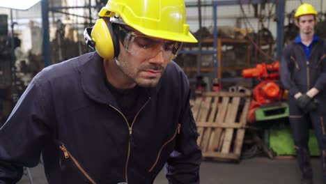 smart factory worker using machine in factory workshop