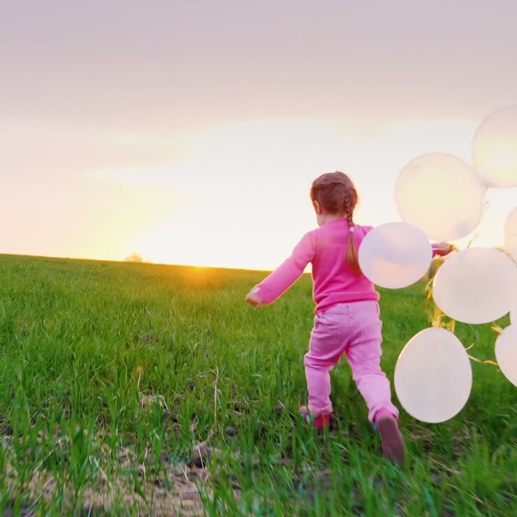 Little Girl In Pink Clothes With Balloons
