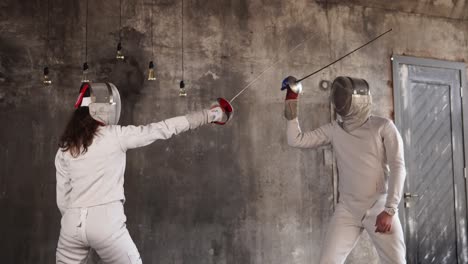 two fencers in a competition