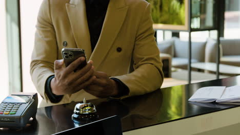 African-american-man-hand-giving-the-reservation-to-receptionist