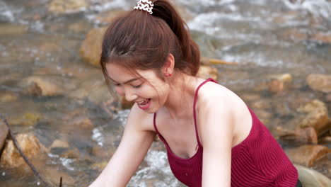 beauty women are relaxed and cheerful with play water splashing flow in rivers and wet on summer vacations time