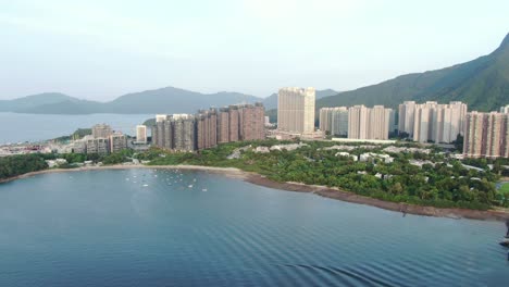 Aerial-view-of-Hong-Kong-Wu-Kai-Sha-area-with-modern-residential-building-complex-and-open-bay