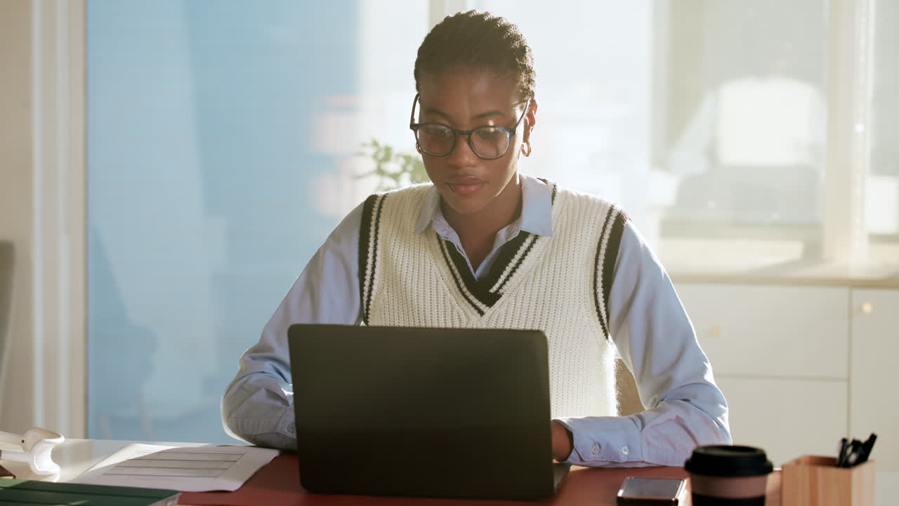 Woman working on laptop in office