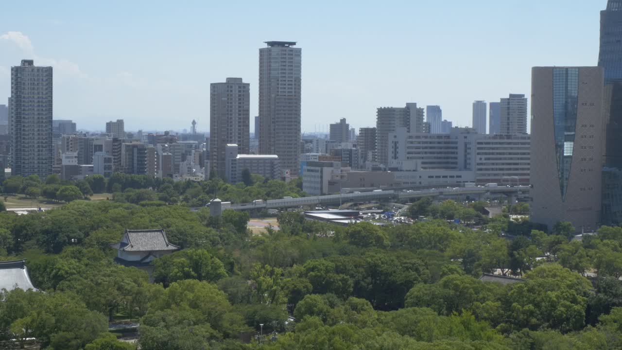 Osaka Skyline From Osaka Castle Park In Japan. - wide shot