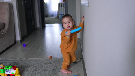 toddler playing with toys in a living room