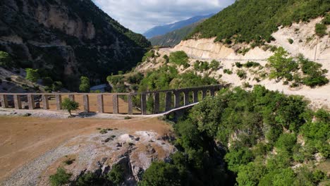 old aqueduct on vjosa river branch, beautiful landscape, roman architecture in albania