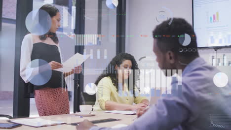 Animation-of-multiple-graphs-and-trading-board-over-diverse-coworkers-discussing-report-in-office