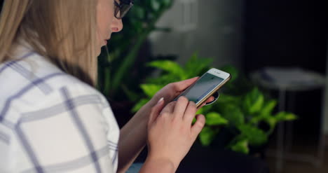 Businesswoman-Using-Wireless-Computer-At-Workplace-3