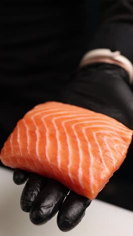 chef preparing raw salmon