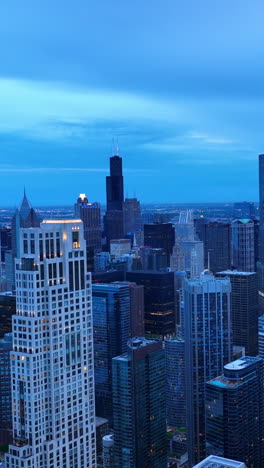 panoramic view of chicago colored blue. amazing scenery of the city at dusk time from aerial perspective. vertical video