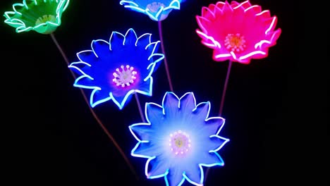 neon flowers on a black background