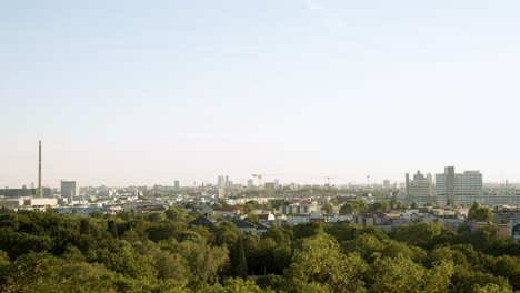 urban cityscape view of berlin with green trees and towers in summer